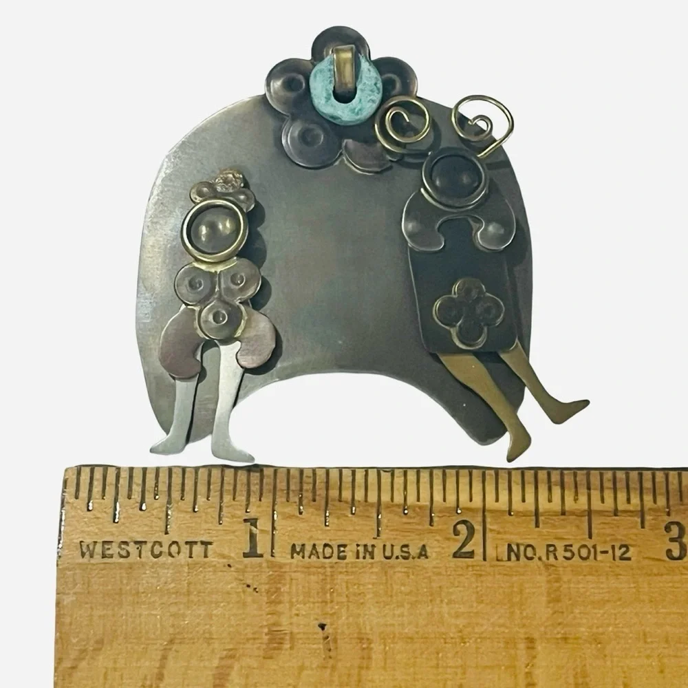 Vintage Metal Figural Brooch with Blue Stone